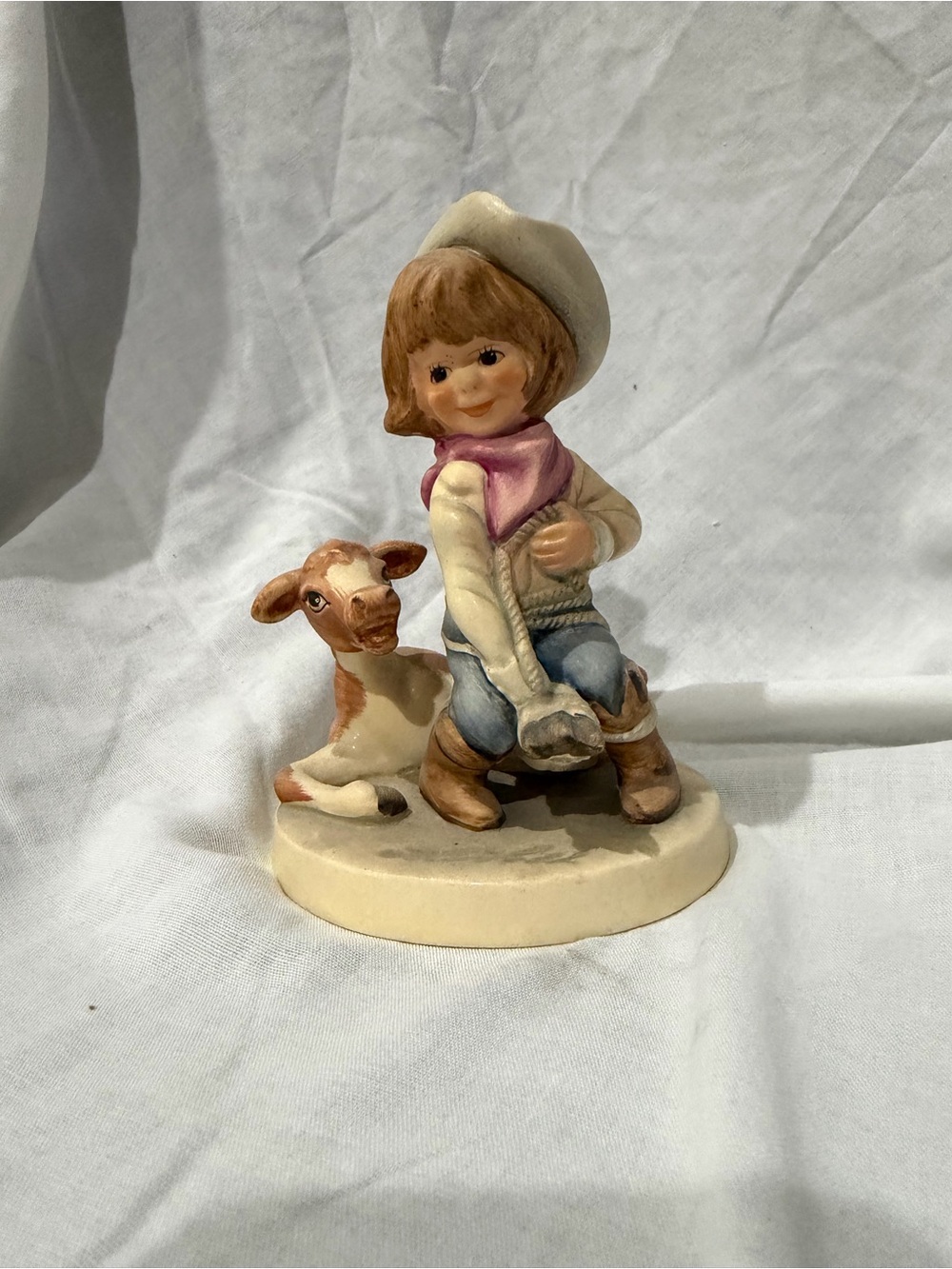 Goebel Porcelain Cowgirl Figurine in Cream, Pink, Blue and Brown